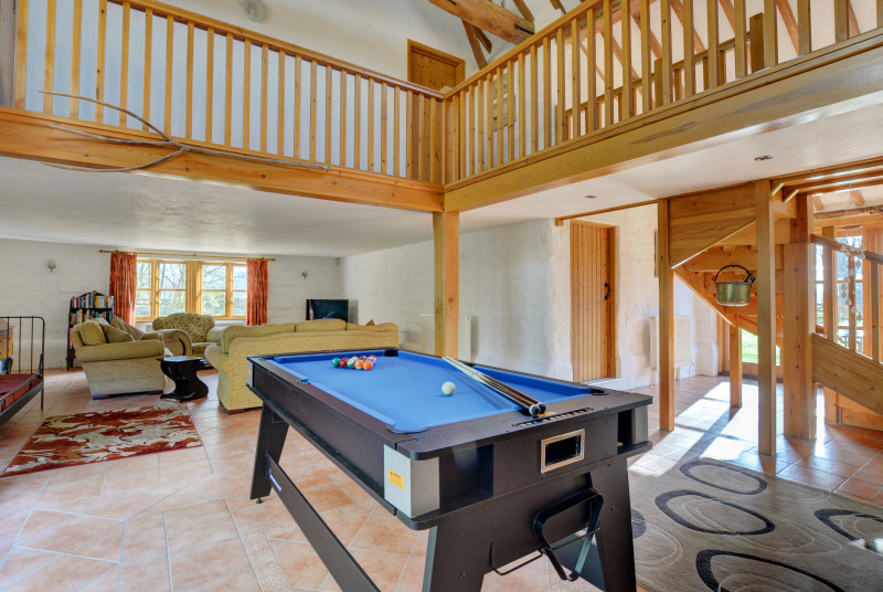 The hall at the centre of the open plan ground floor is home to a pool table which will be popular with everyone in the party