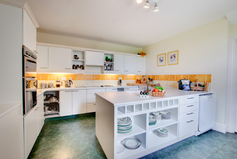 Modern Kitchen with microwave, fan oven, hob, dishwasher, fridge & fully fitted units.