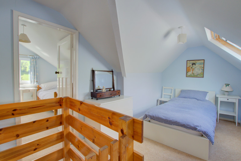 Two twin bedrooms are approached by a 1930s wooden loft ladder - suitable for adventurous older children and adults!