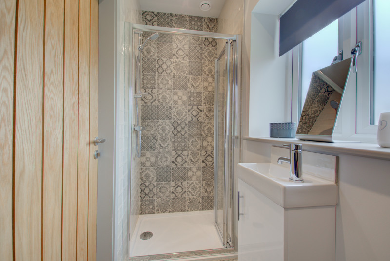 Bedroom 1 En-suite with shower & wash basin