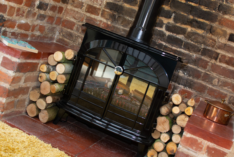 Woodburner set in inglenook fireplace