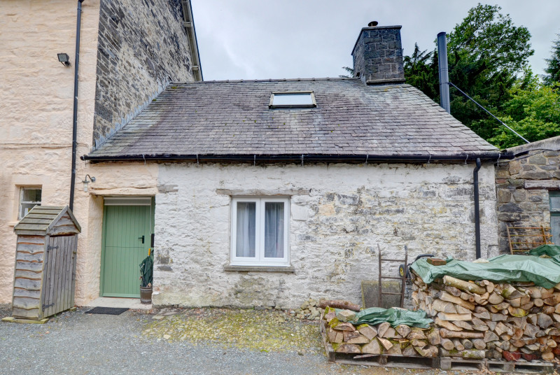 A tiny stone cottage to the rear of the owner's large Country House