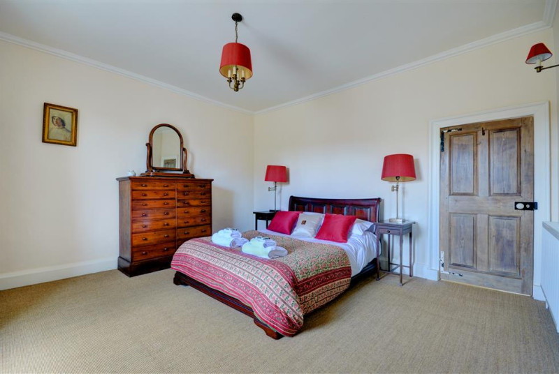 Spacious bedroom with king sized sleigh bed