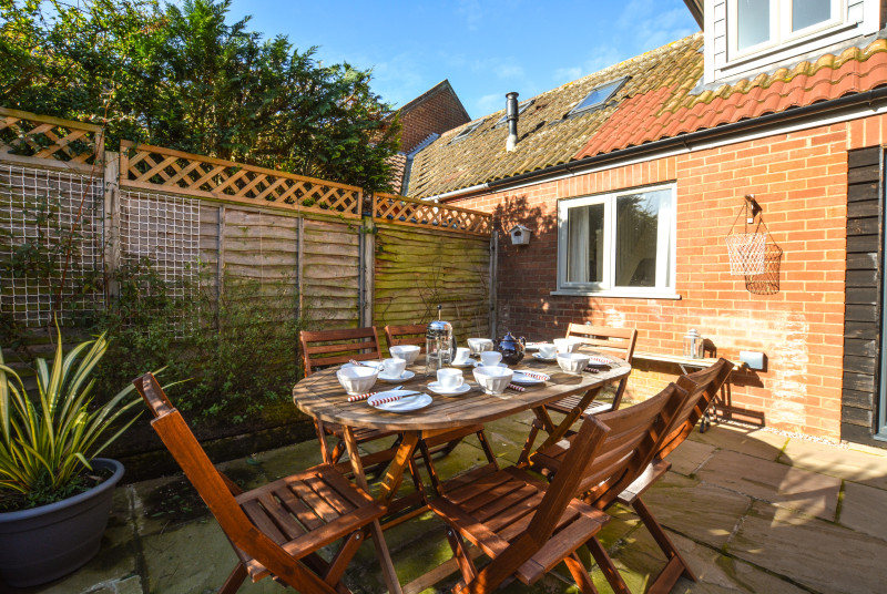 Patio with table and chairs for a spot of outdoor dining