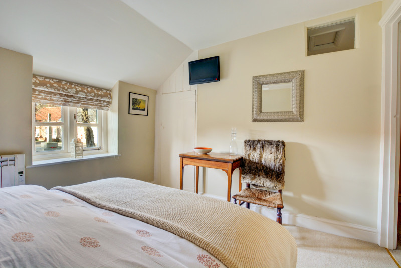 The main bedroom is decorated in neutral tones to create a peaceful atmosphere