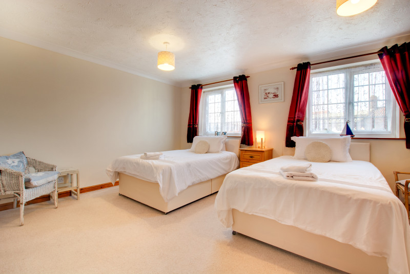 The twin room is light and bright with double aspect windows