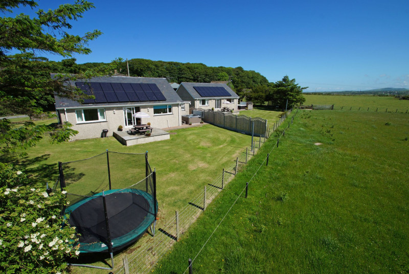 Minffordd (furthest) is one of two 5 star cottages on site - each with its own enclosed garden and hot tub