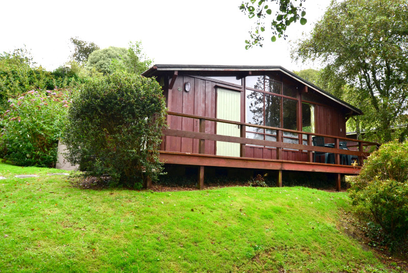 Exterior shot of the lodge, situated in a popular holiday park