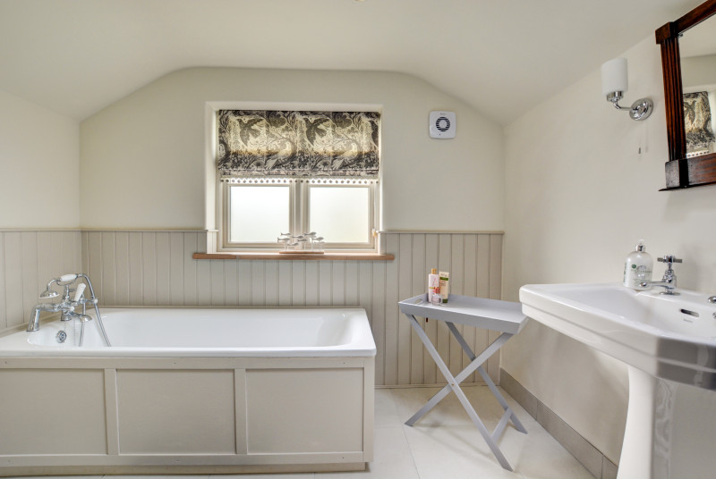 Bedroom 1 En-Suite with bath and wash basin