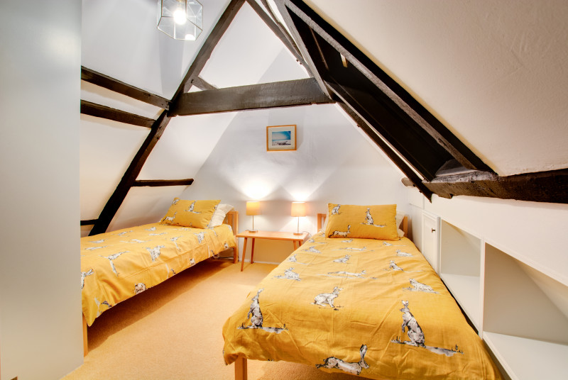 Attractive twin bedroom tucked under the eaves