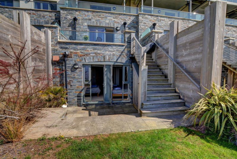 The bedrooms are situated downstairs with access to the patio and garden area