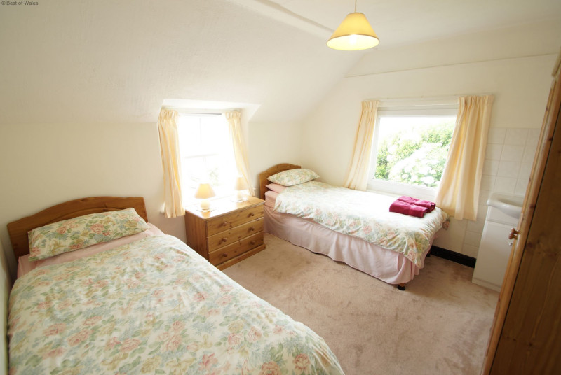 Second twin bedroom with sea and countryside views