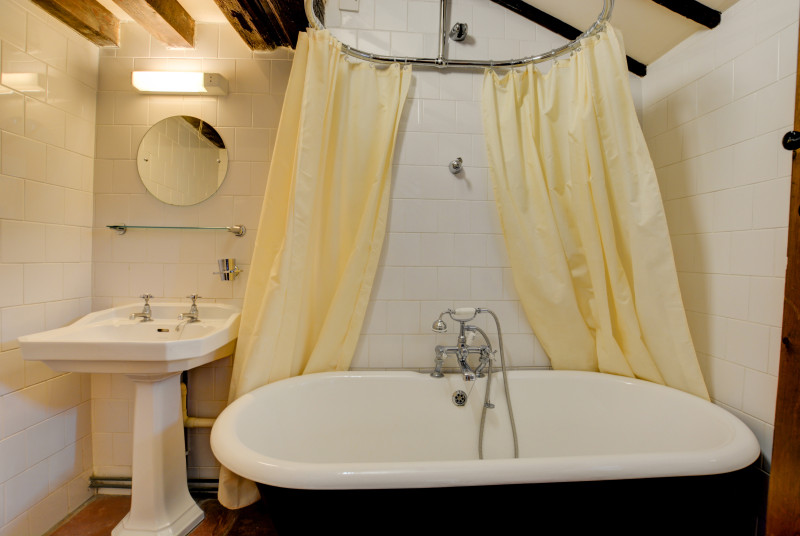Ground floor bathroom with a lovely claw foot bath and over- bath shower