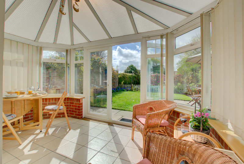 Light and airy conservatory with cane seating, a pleasant additional seating area