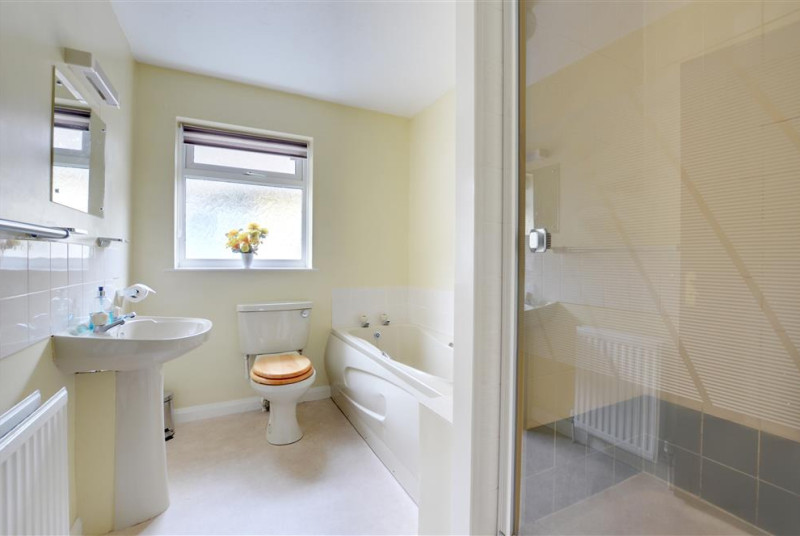 Bathroom with separate bath and shower cubicle