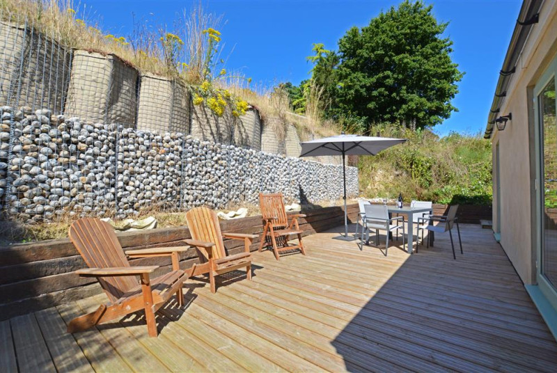 Decked area with table and chairs
