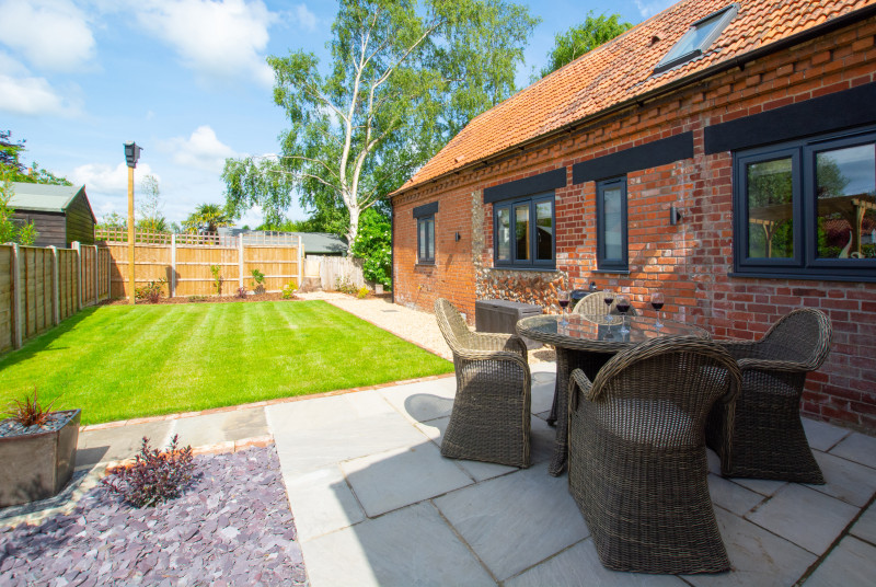 Lawn & patio area with garden furniture