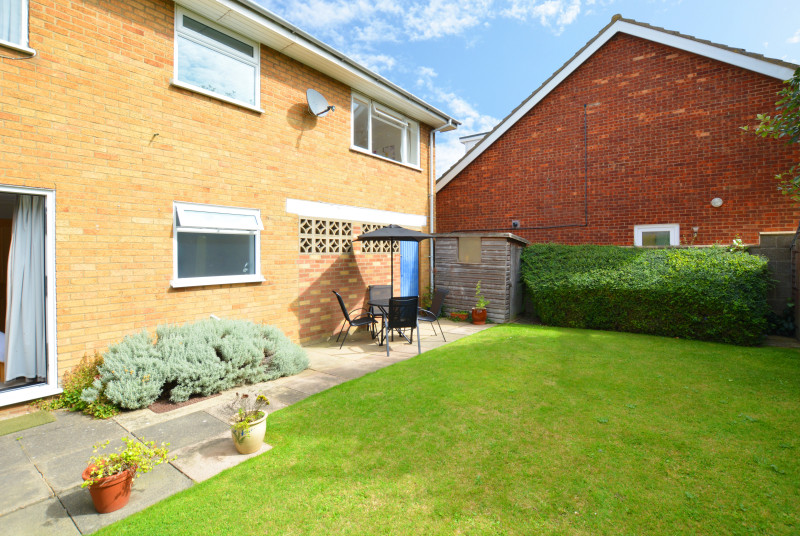 Fully enclosed lawned garden with patio area, garden furniture and barbecue, ideal for al fresco dining