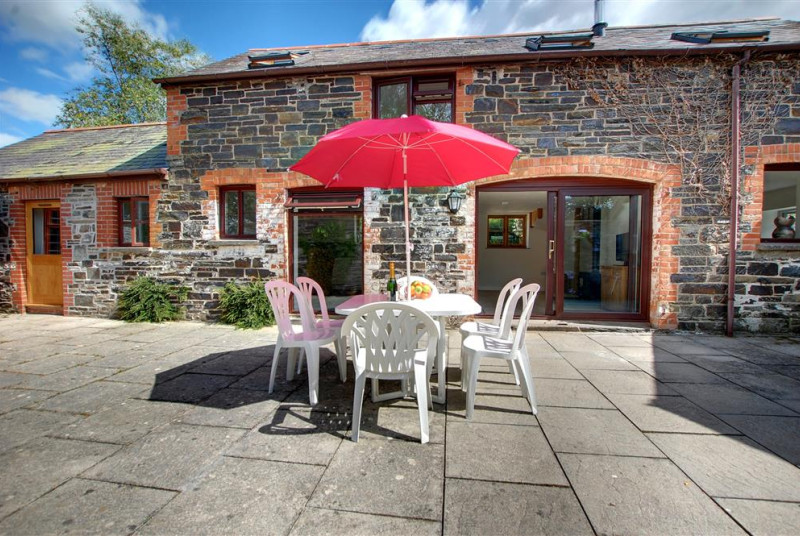 Large and fully enclosed sun trap courtyard ideal for relaxation and al fresco dining