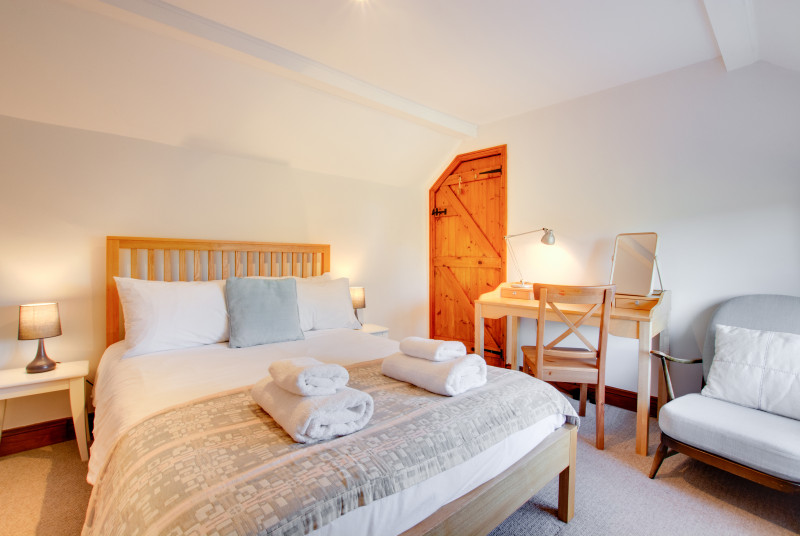 Double bedroom is cosy with beautiful soft furnishings