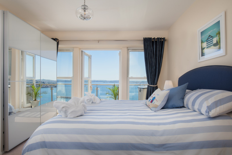 Master bedroom ensuite with doors to the balcony