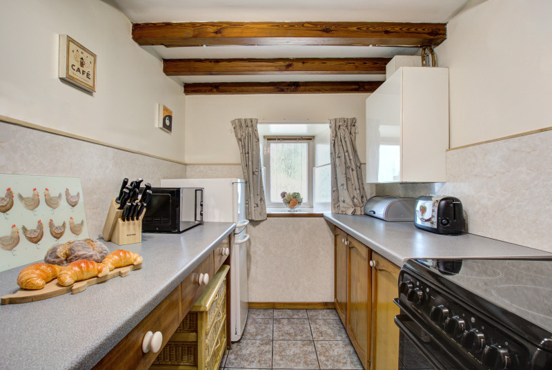 Kitchen with beamed ceiling