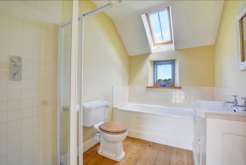 Bathroom with bath and seperate shower cubicle