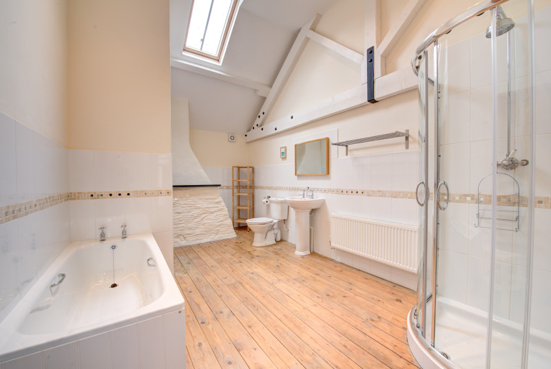 The bathroom is very generously apportioned with both a bath and separate corner powerful shower