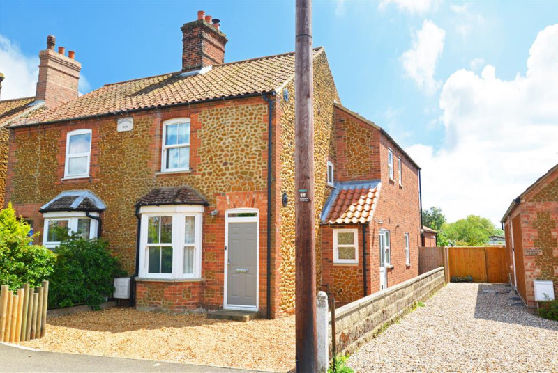 Exterior image of this traditional brick and carrstone cottage