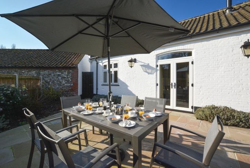 Outside patio with furniture and umbrella