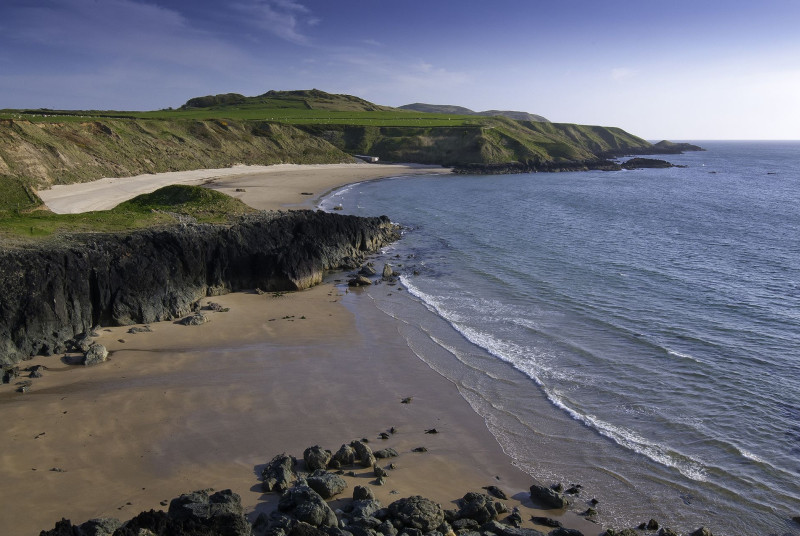 The sand at Porth Oer (5.5 miles) sometimes 'squeaks' under your feet