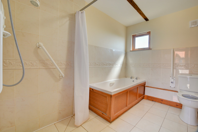 Bathroom / wet room with bath, wc, wash basin & shower