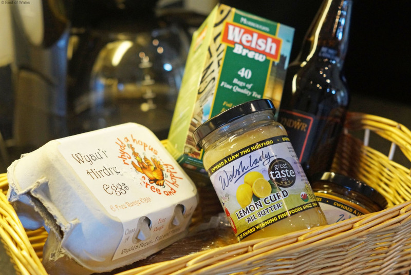 A spacious, cream 'shaker' style kitchen with a farmhouse pine table.