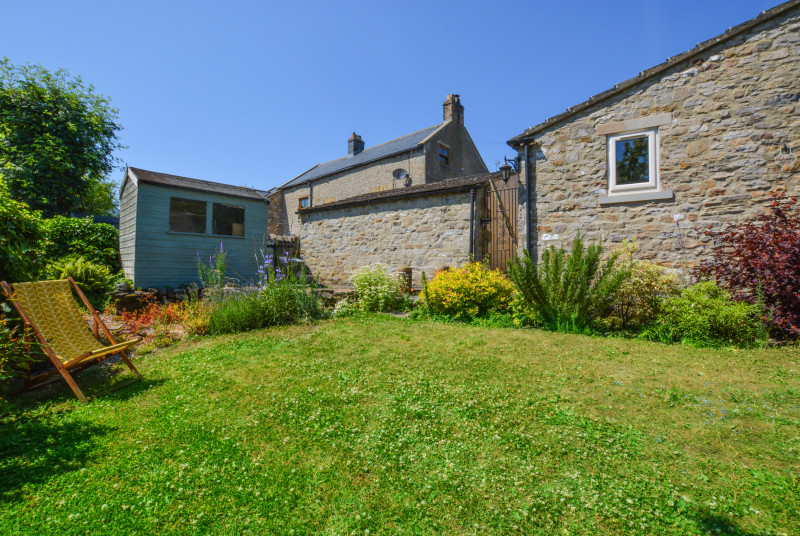 The beautiful cottage garden leading down to the brook
