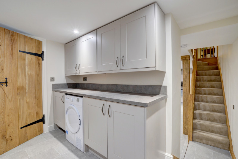 Useful utility room with downstairs cloakroom