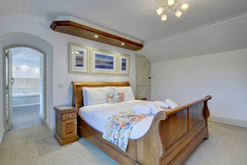 The master bedroom with a sleigh style bed