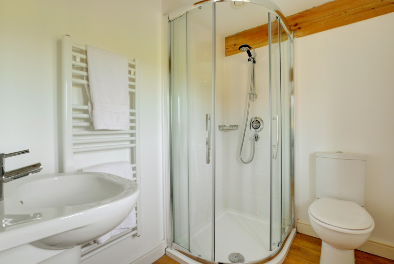 Light and modern en-suite shower room.