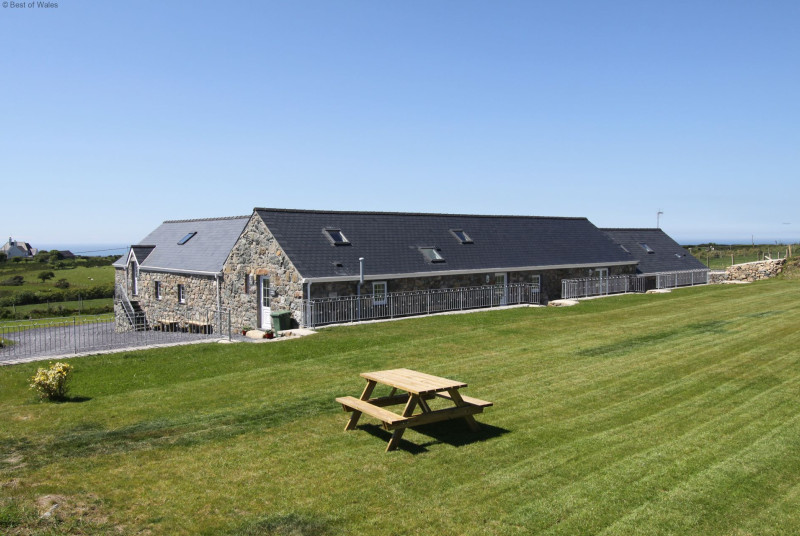 Spacious communal garden with countryside and sea views.