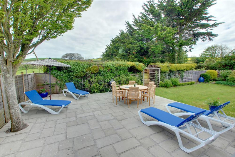 Large patio area with garden furniture 