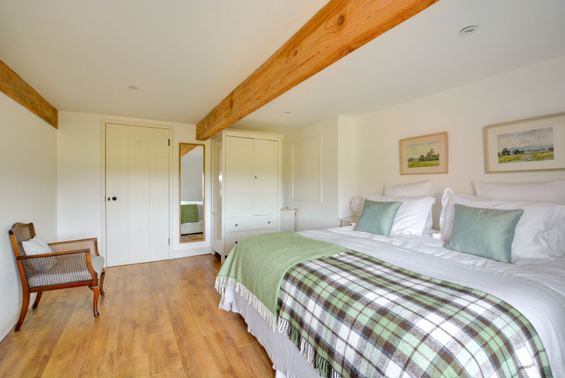 With the luxury of an en-suite, a bright and airy bedroom.