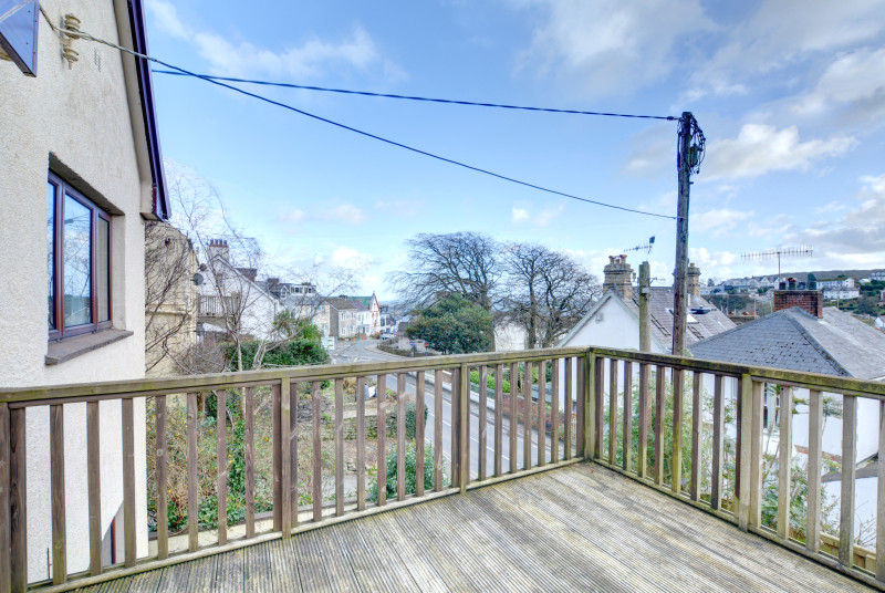 A large decked balcony with views down Saundersfoot High Street from the family bedroom.