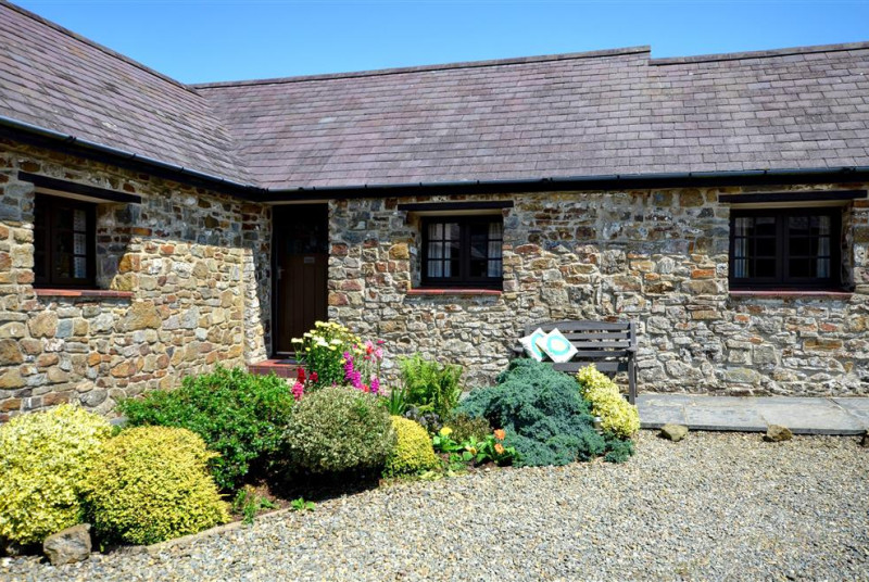 Wishing Well is in the corner of this L shaped group of cottages