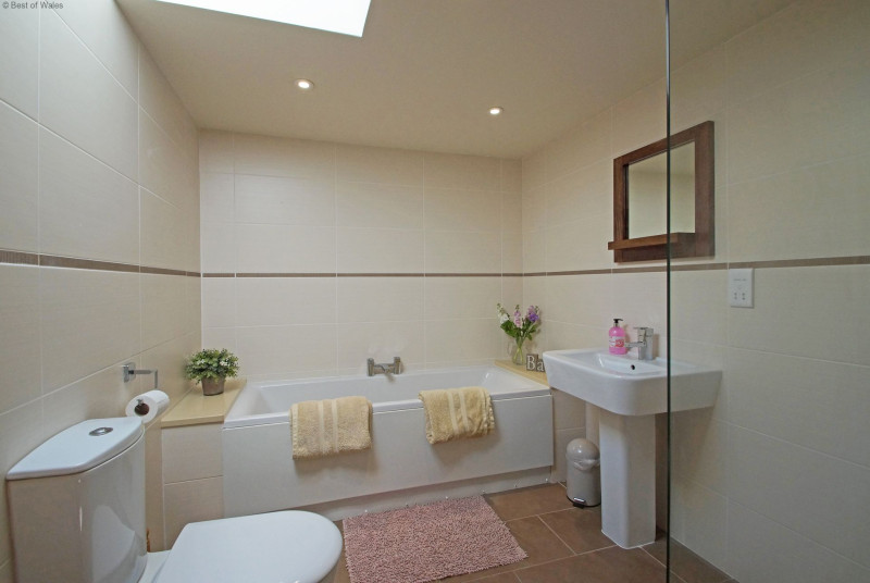 Stylish bathroom with an impressive bath & wet-room style shower