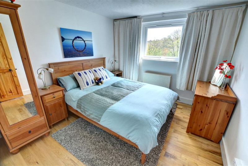 Big double bed in the bedroom, wardrobe and views through the window
