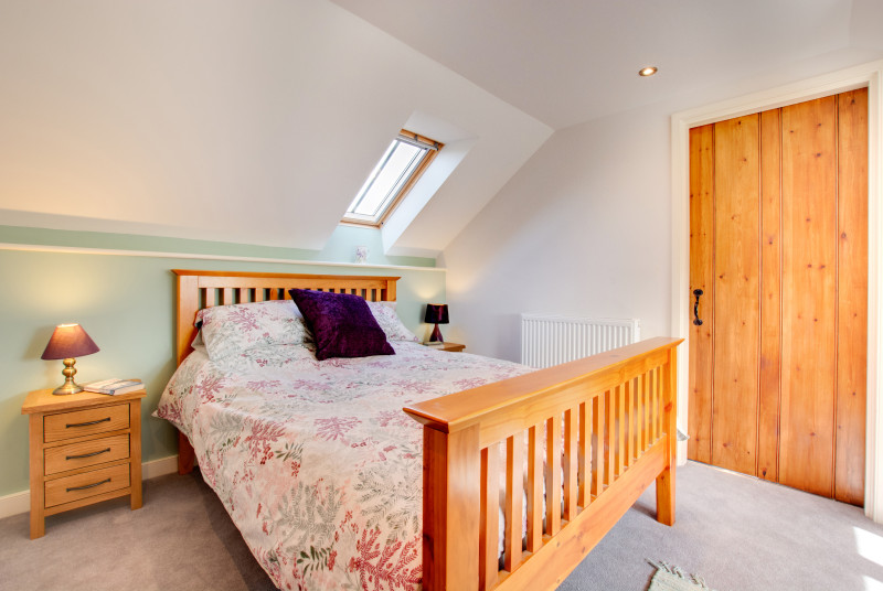 The double bedroom has plenty of storage and is decorated with thoughtful calming touches
