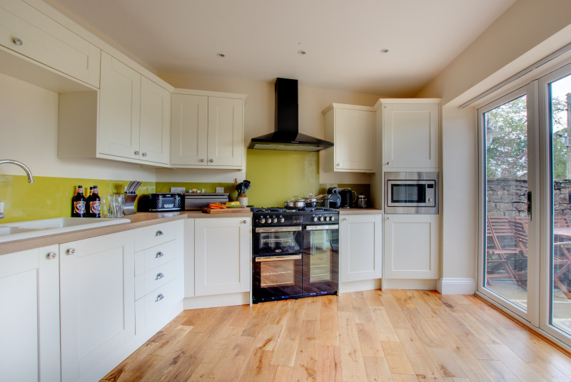 Light, bright and spacious modern kitchen with french windows to the courtyard