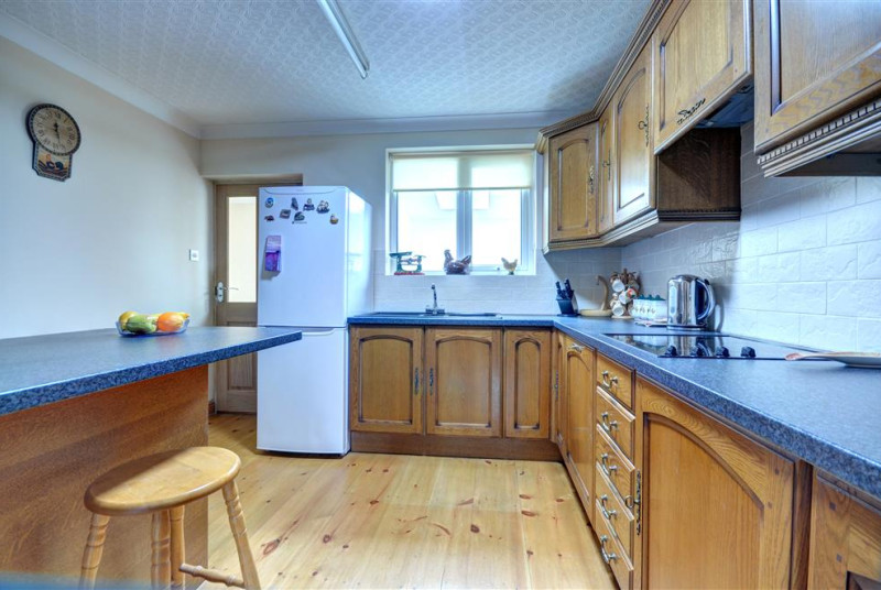 Kitchen is spacious with ample storage