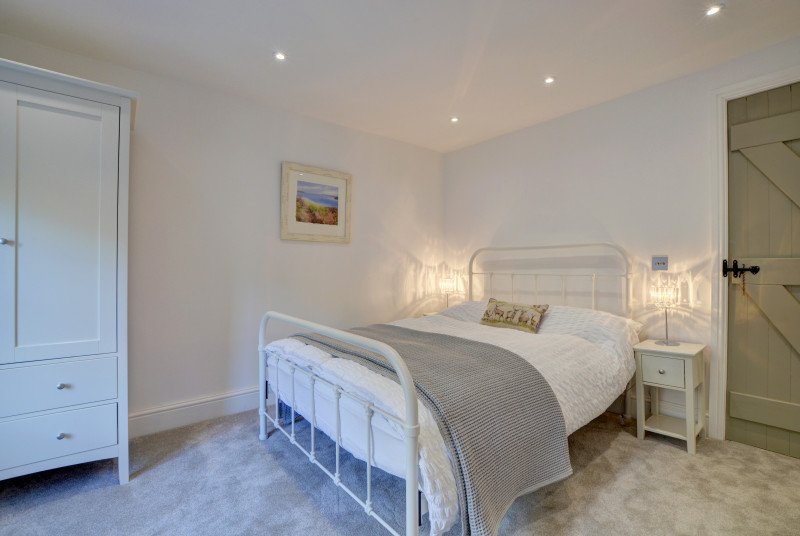 Elegantly decorated master bedroom which has lovely river views