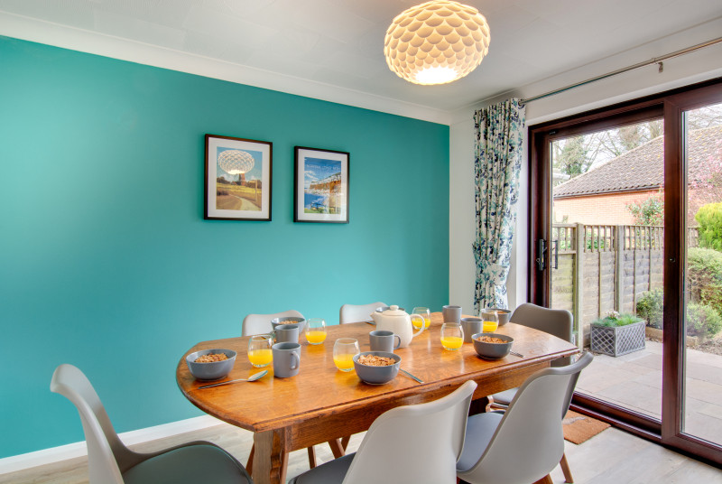 The spacious dining room is the perfect spot for meals together, also benefiting from patio doors in to the enclosed garden