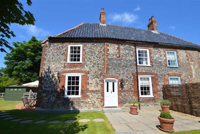 This is the rear of this attractive brick and flint property